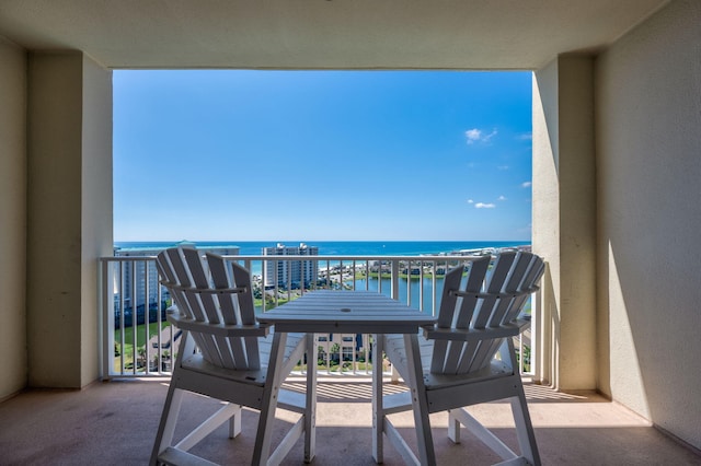 balcony featuring a water view