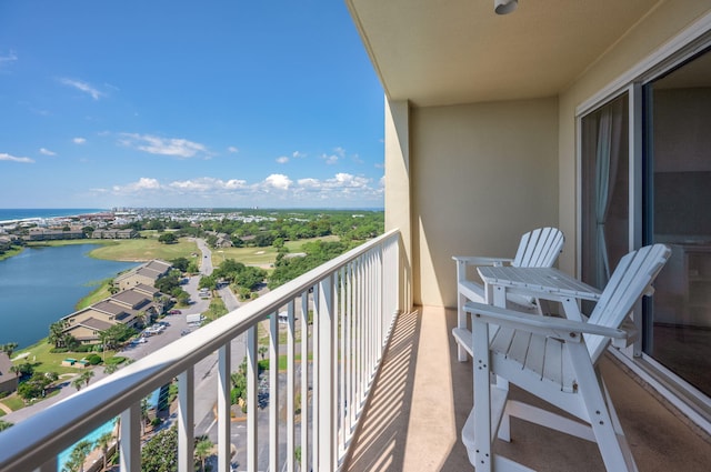 balcony featuring a water view