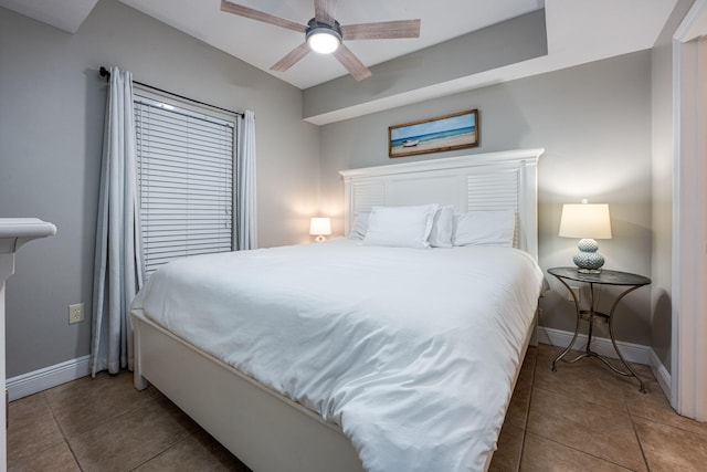 tiled bedroom with ceiling fan