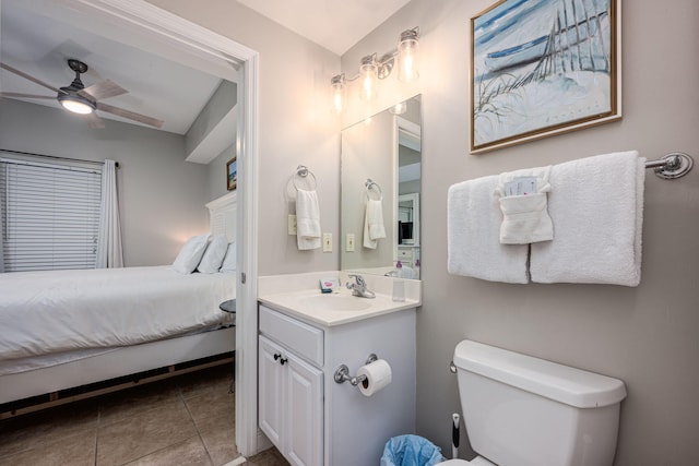 bathroom with vanity, ceiling fan, toilet, and tile patterned floors