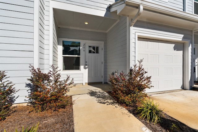 view of exterior entry featuring a garage