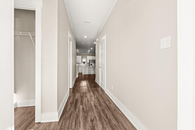 corridor featuring wood-type flooring