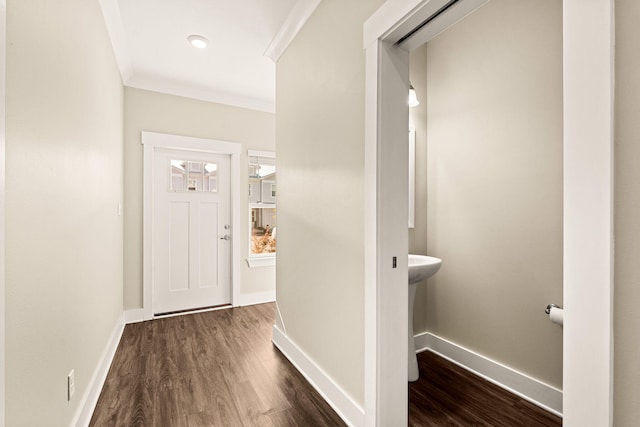 hallway featuring ornamental molding and dark hardwood / wood-style floors