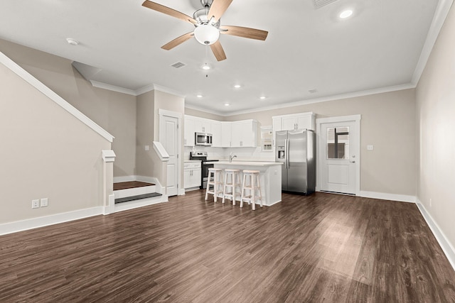 unfurnished living room with crown molding, dark hardwood / wood-style floors, sink, and ceiling fan