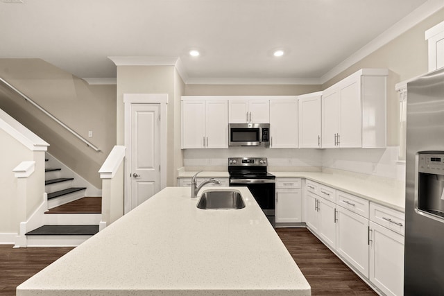 kitchen featuring dark wood-type flooring, white cabinets, stainless steel appliances, and sink