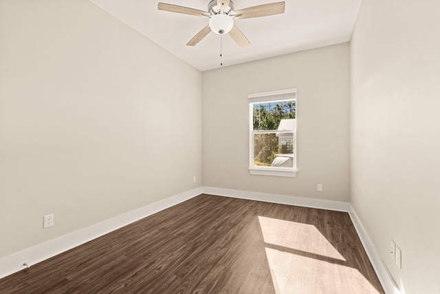 empty room with dark hardwood / wood-style floors and ceiling fan