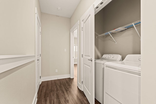 washroom with washer and dryer and dark hardwood / wood-style floors