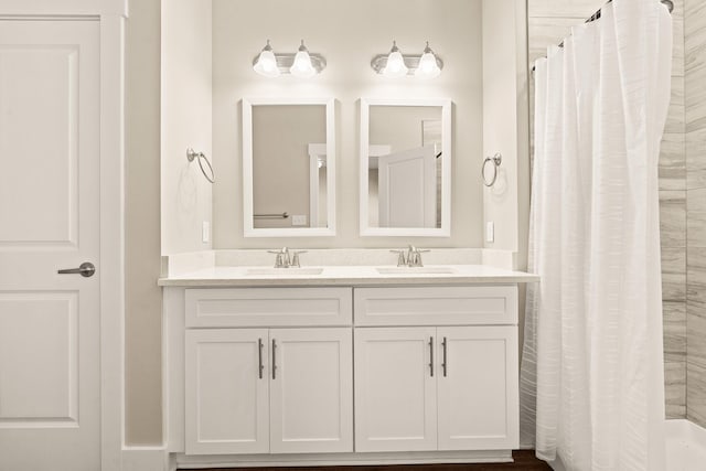 bathroom with vanity and a shower with shower curtain