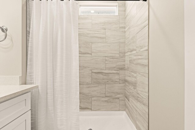 bathroom with vanity and a shower with curtain