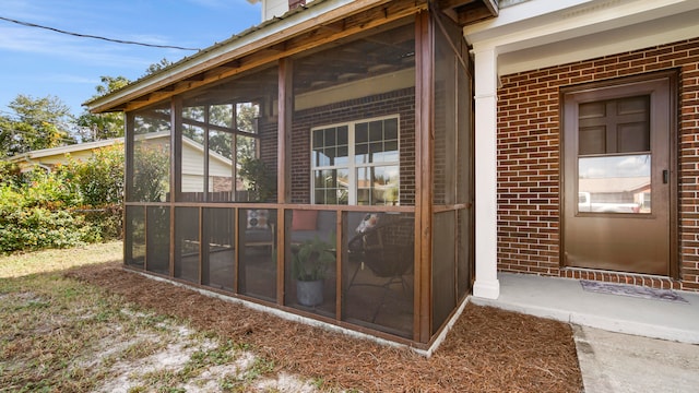 view of property exterior featuring a sunroom