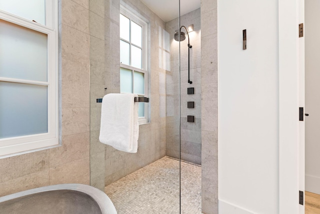 bathroom with a tile shower