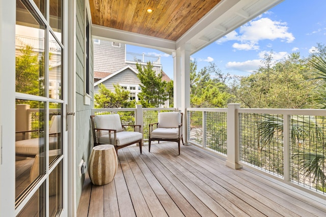 sunroom with wooden ceiling