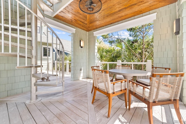 sunroom / solarium featuring wood ceiling