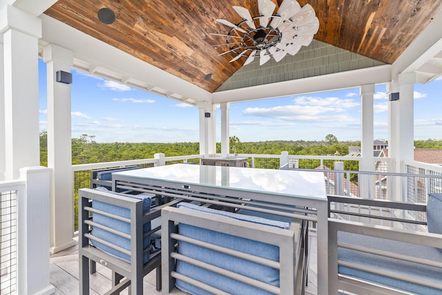 view of patio / terrace with a balcony and ceiling fan