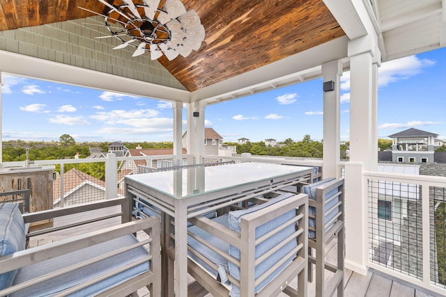 wooden deck featuring ceiling fan