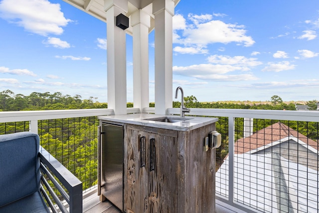 wooden deck featuring sink