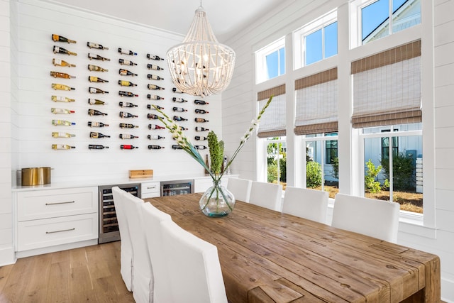 dining space featuring wine cooler and a wealth of natural light