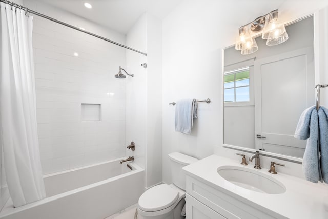 full bathroom with vanity, toilet, and shower / bath combo with shower curtain