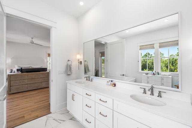 bathroom with vanity and ceiling fan