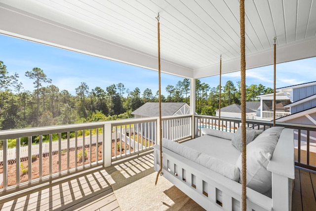 wooden terrace featuring an outdoor hangout area