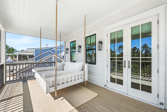 sunroom with french doors and wood ceiling