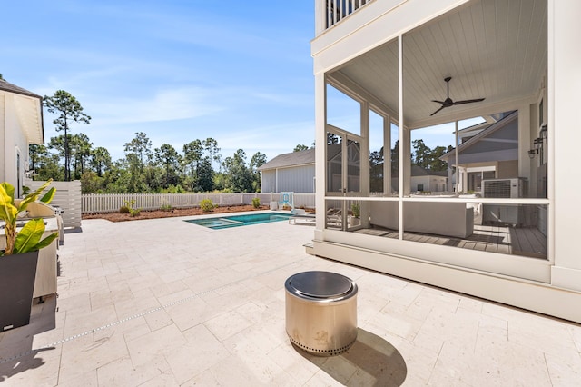 view of patio / terrace featuring a fenced in pool and ceiling fan