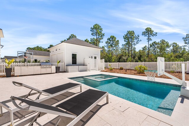 view of swimming pool with an in ground hot tub, a patio, and a grill