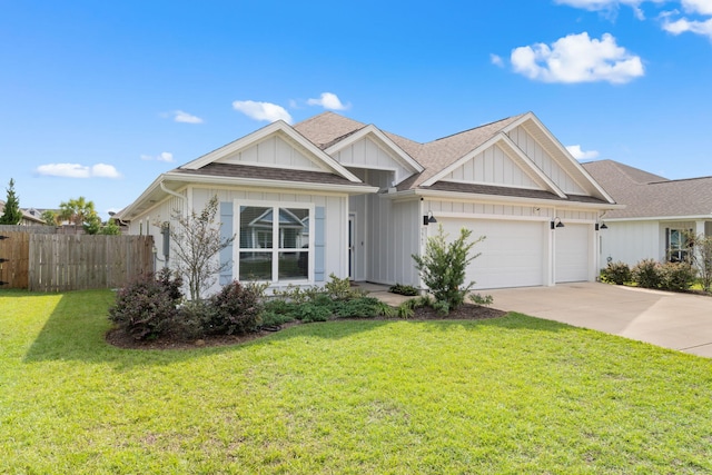 view of front of property featuring a front lawn and a garage