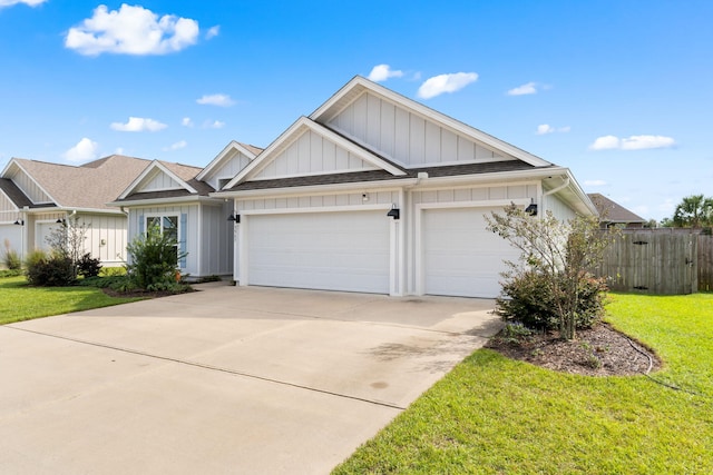 view of front of house with a garage and a front lawn