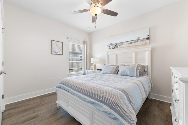 bedroom with dark hardwood / wood-style floors and ceiling fan