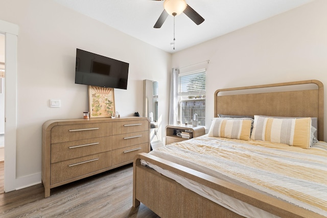 bedroom featuring wood-type flooring and ceiling fan