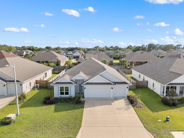 view of front facade with a front yard and a garage