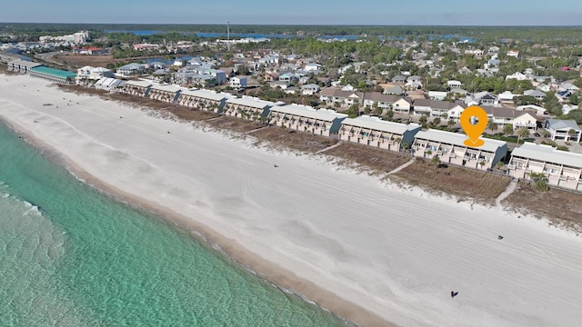 drone / aerial view featuring a view of the beach and a water view