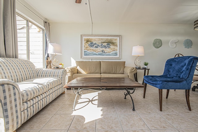 living room featuring light tile patterned floors and ceiling fan