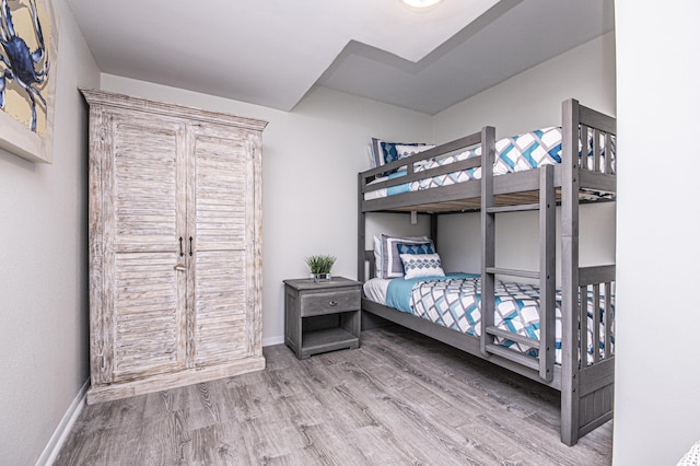 bedroom with wood-type flooring