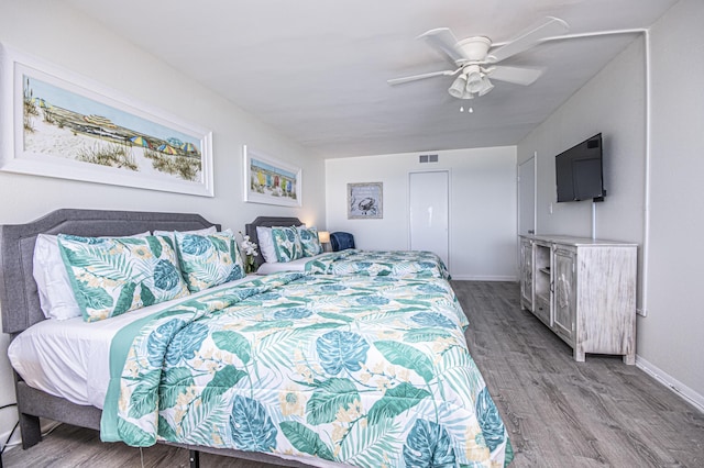 bedroom with wood-type flooring and ceiling fan