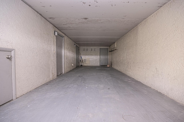 corridor with concrete flooring