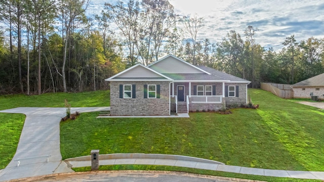 view of front of home featuring covered porch and a front lawn