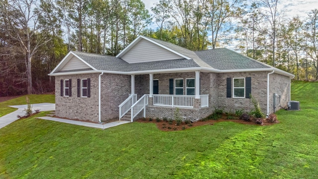 view of front of property with a porch, central AC unit, and a front yard