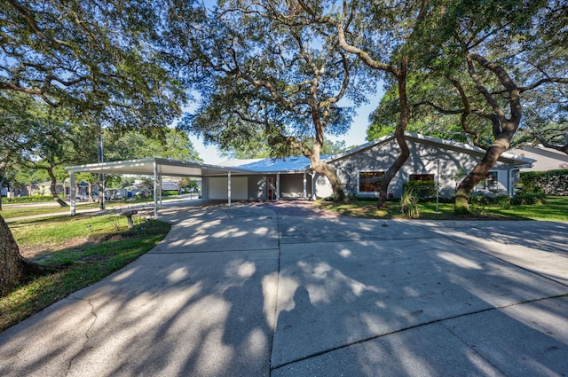 ranch-style house with a carport