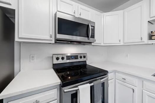 kitchen with white cabinets and stainless steel appliances