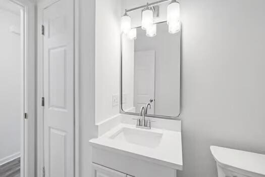 bathroom with toilet and vanity