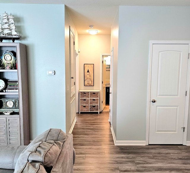 corridor featuring wood-type flooring