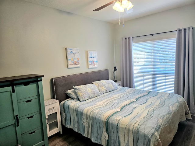 bedroom featuring ceiling fan and dark hardwood / wood-style floors