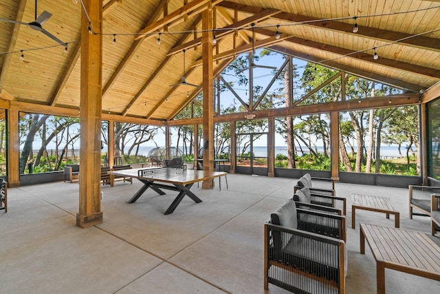 view of patio featuring a gazebo and a water view