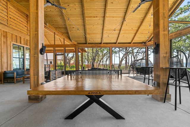 unfurnished sunroom with wood ceiling and lofted ceiling with beams