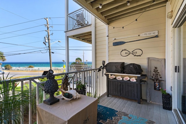 balcony featuring a water view