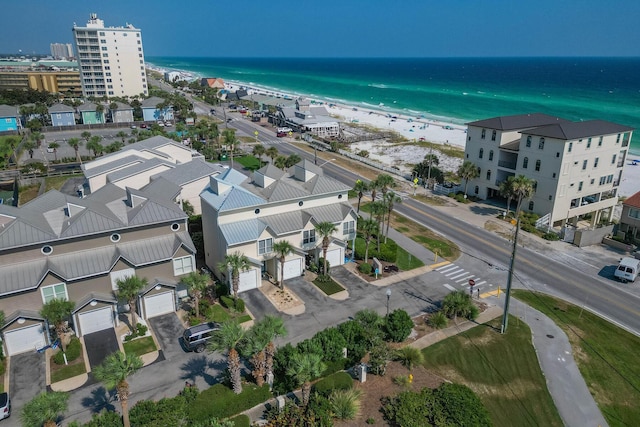 drone / aerial view with a beach view and a water view