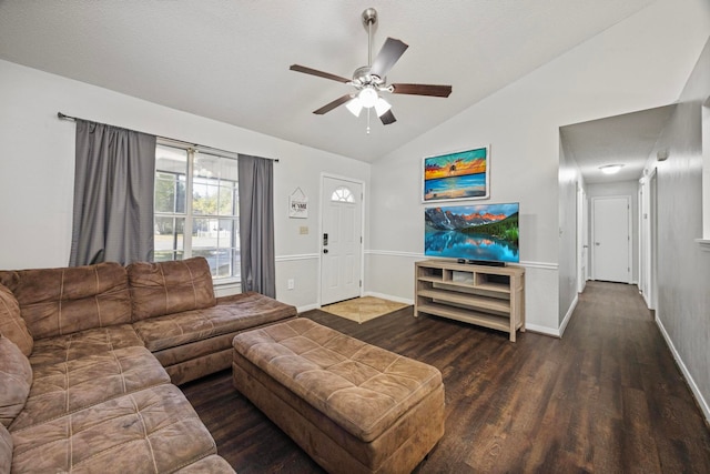 living room featuring ceiling fan, vaulted ceiling, and dark hardwood / wood-style floors