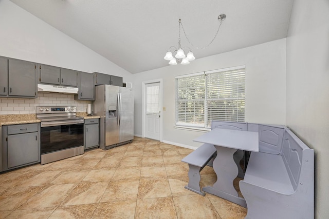 kitchen with stainless steel appliances, tasteful backsplash, hanging light fixtures, a notable chandelier, and vaulted ceiling